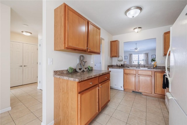 kitchen with ceiling fan, white appliances, and light tile patterned flooring