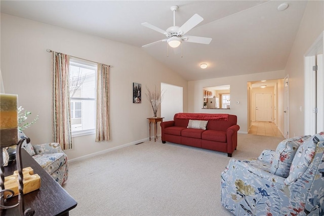 carpeted living room featuring vaulted ceiling and ceiling fan