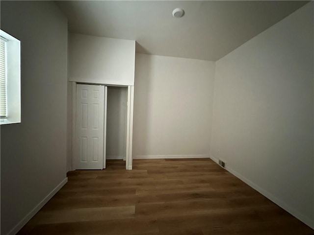 interior space with dark wood-type flooring