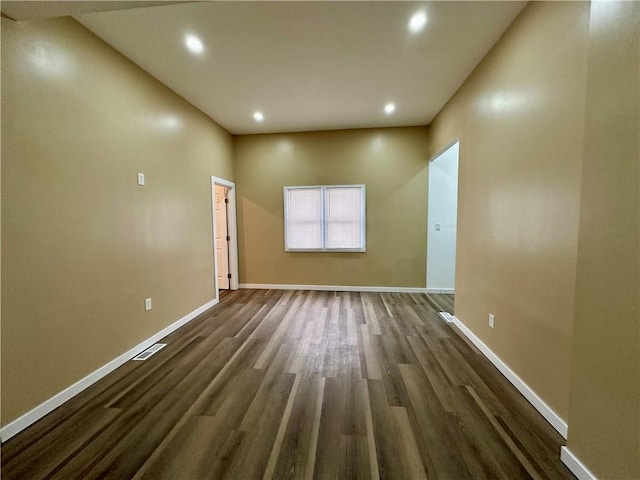 unfurnished room featuring dark hardwood / wood-style floors