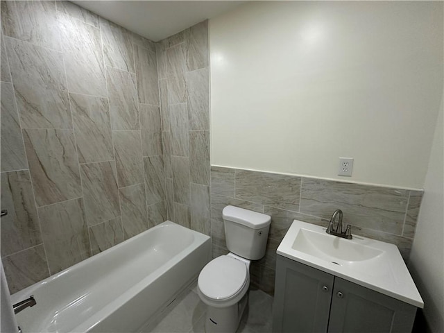 bathroom featuring tile walls, toilet, and vanity