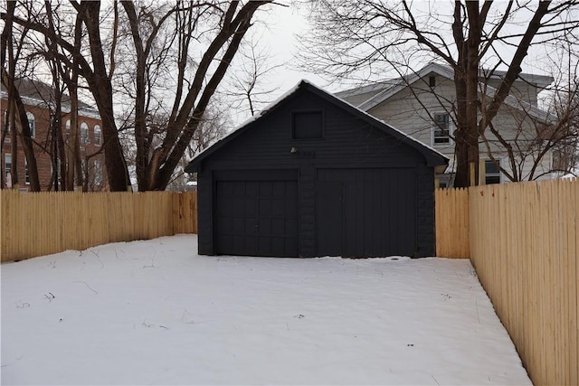 view of snow covered garage