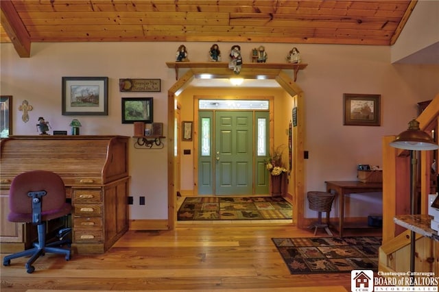 foyer entrance with light wood-type flooring, lofted ceiling, and wood ceiling