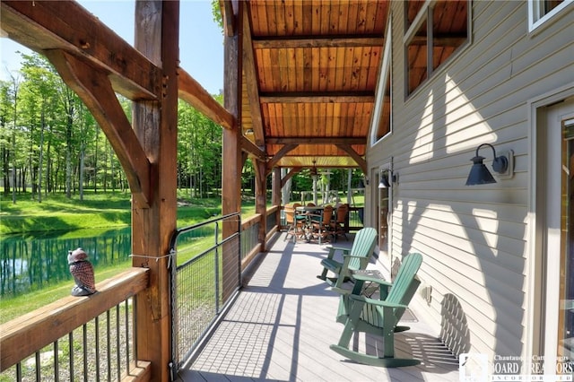 deck featuring a water view