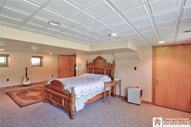 bedroom featuring light carpet