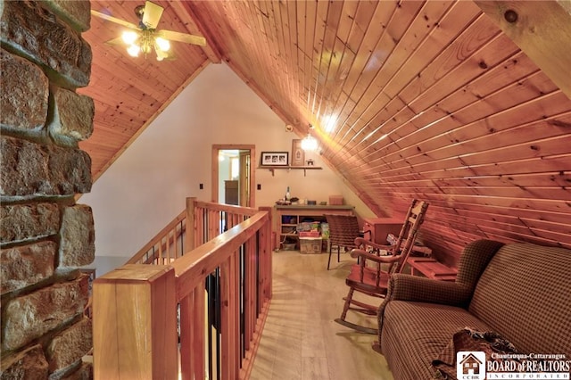 bonus room with wooden ceiling and lofted ceiling with beams