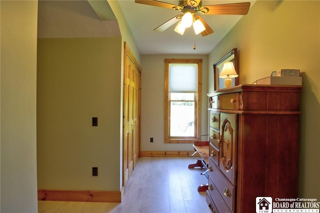 interior space with ceiling fan and light wood-type flooring