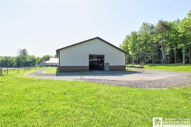 exterior space featuring an outbuilding and a yard