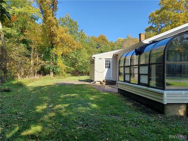 view of yard with a sunroom