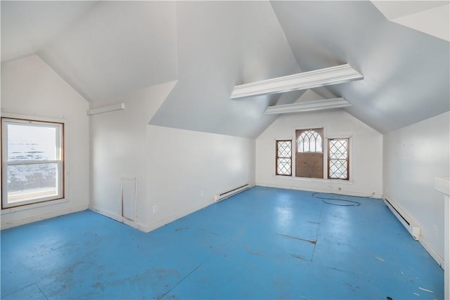 additional living space featuring baseboard heating and lofted ceiling