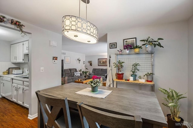 dining room featuring dark wood-type flooring