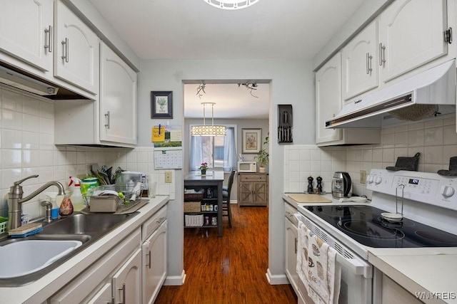 kitchen with decorative light fixtures, dark wood-type flooring, white cabinetry, white range with electric cooktop, and sink