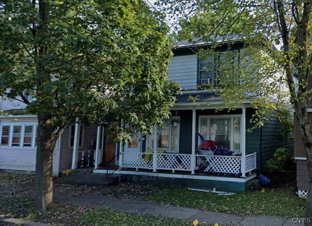 obstructed view of property featuring a porch