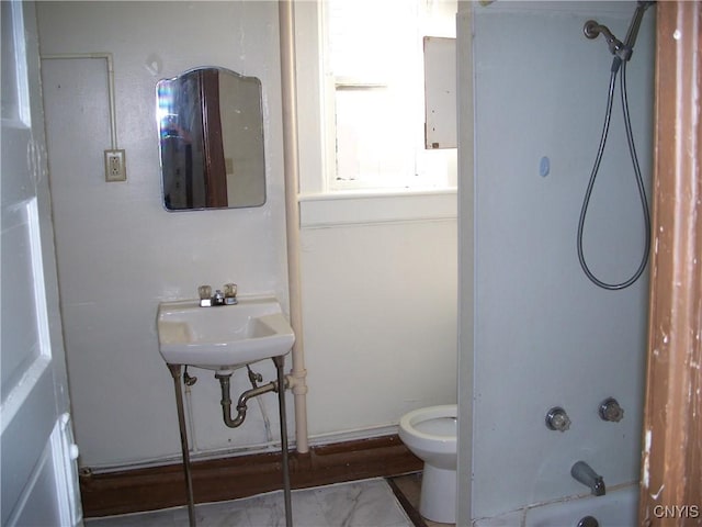 full bathroom featuring sink, shower / tub combination, and toilet