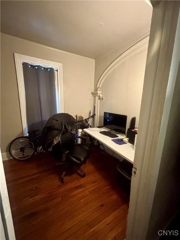 office with dark hardwood / wood-style floors