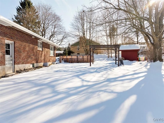 view of yard layered in snow