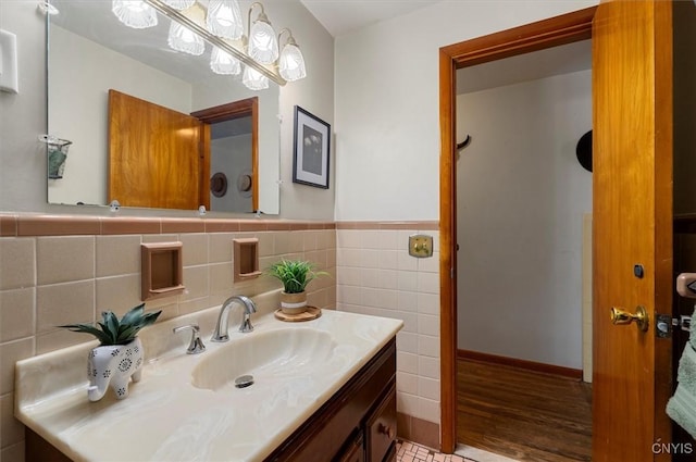 bathroom with tile walls and vanity