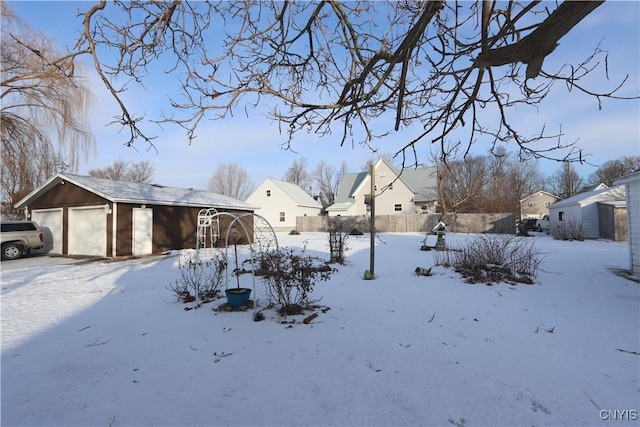 yard covered in snow with an outdoor structure