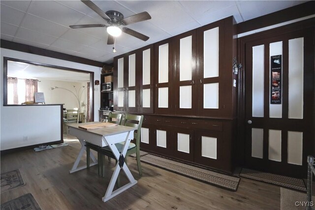 514 Main St, Brownville, NY 13601 - dining area with wood finished floors, a ceiling fan, and baseboards