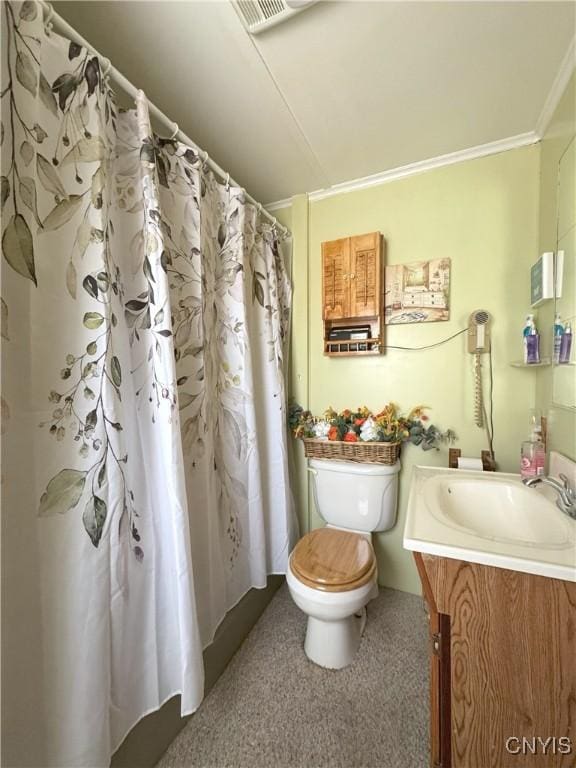 bathroom with vanity, ornamental molding, curtained shower, and toilet