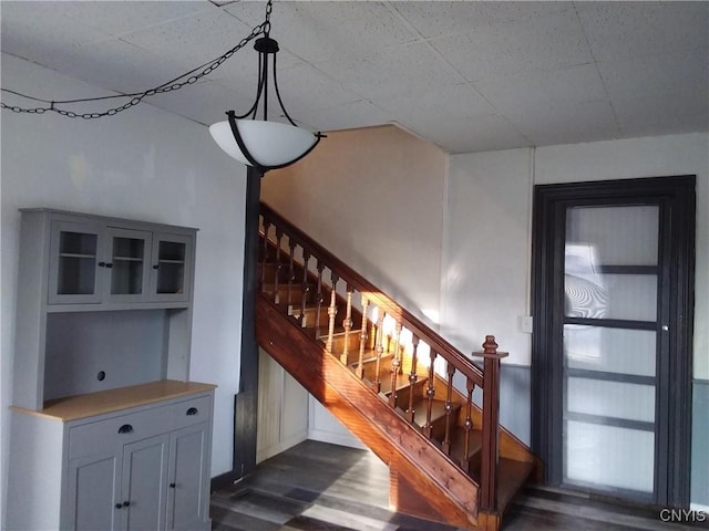 stairs with hardwood / wood-style floors