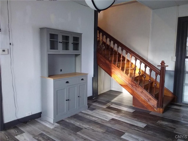 stairway with hardwood / wood-style flooring