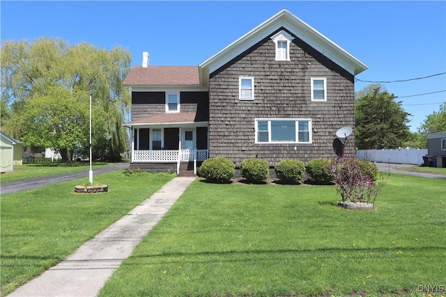 514 Main St, Brownville, NY 13601 - view of front of house featuring a front yard and a chimney