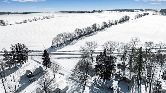 snowy aerial view featuring a rural view