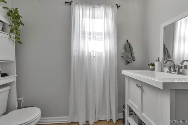 bathroom featuring sink and toilet