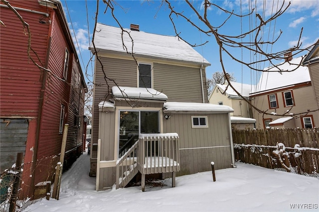 view of snow covered house