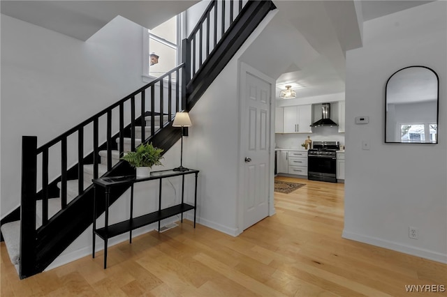 stairway with wood-type flooring