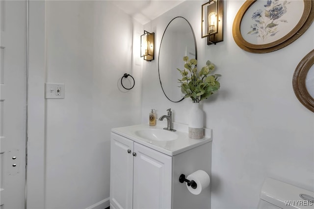 bathroom with vanity and toilet