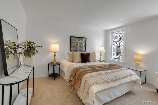 bedroom featuring light colored carpet