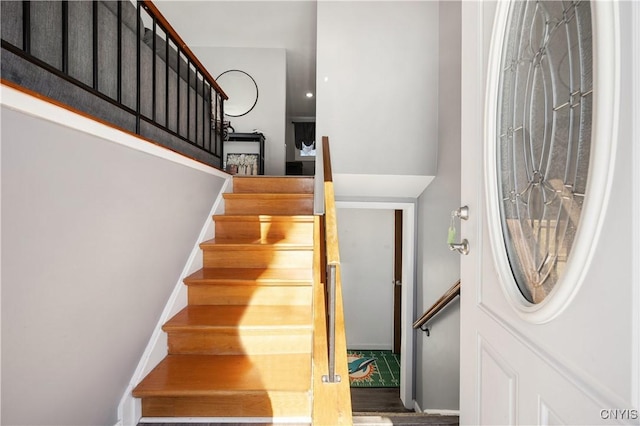 stairway featuring hardwood / wood-style floors