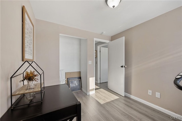 home office featuring hardwood / wood-style floors