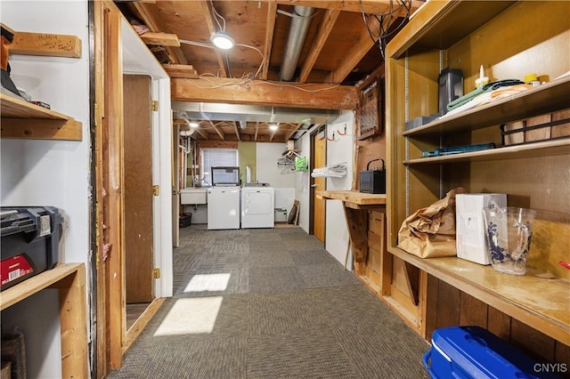 storage room featuring sink and washing machine and clothes dryer