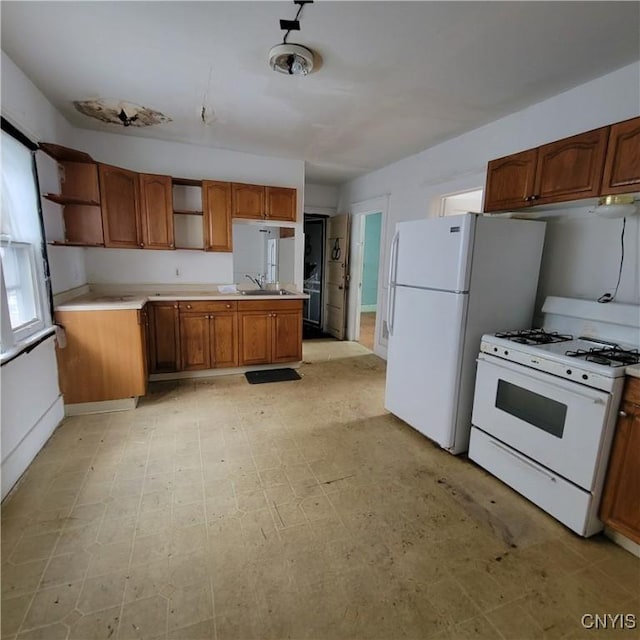 kitchen with white appliances and sink