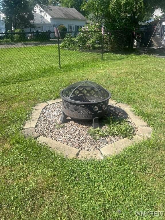 view of yard featuring an outdoor fire pit