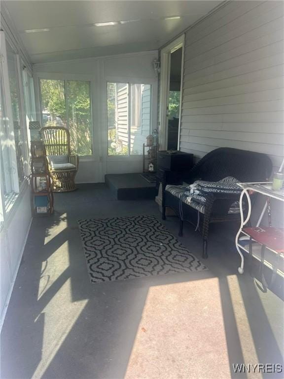 sunroom / solarium with vaulted ceiling