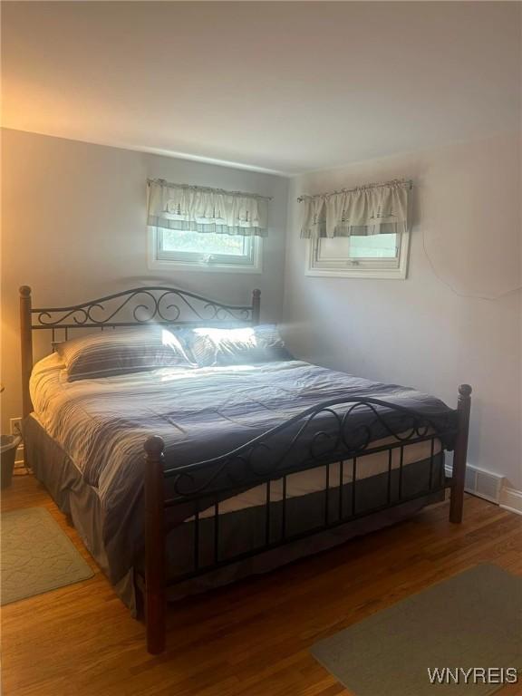 bedroom featuring wood-type flooring