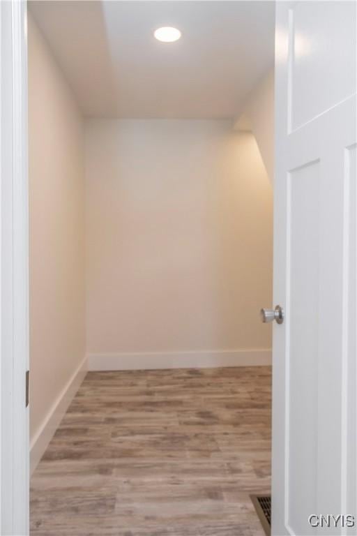 interior space featuring recessed lighting, light wood-type flooring, and baseboards