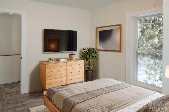 bedroom featuring wood finished floors