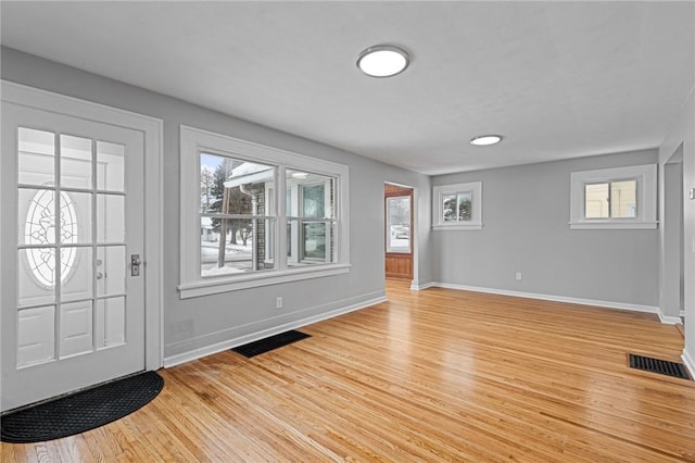 foyer with light hardwood / wood-style floors