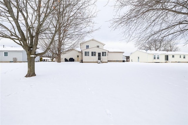 view of yard layered in snow