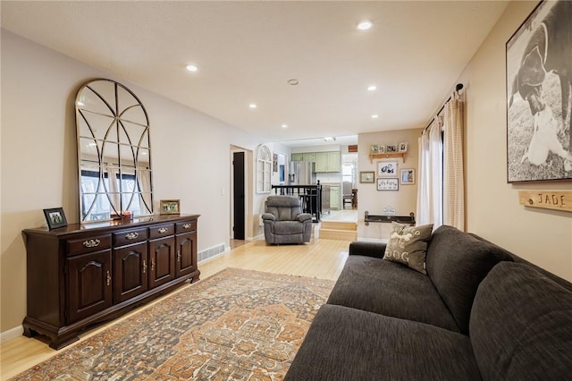 living room with light hardwood / wood-style floors