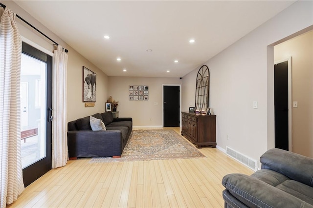 living room with light hardwood / wood-style floors