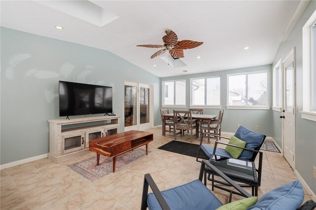 living room featuring vaulted ceiling and ceiling fan