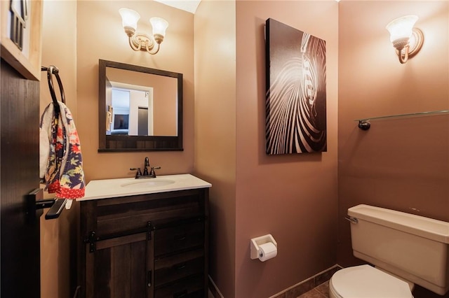 bathroom featuring toilet and vanity