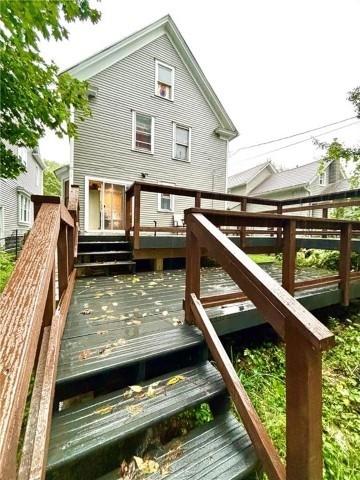 rear view of property with a wooden deck