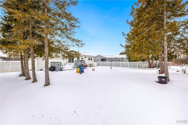 view of yard covered in snow